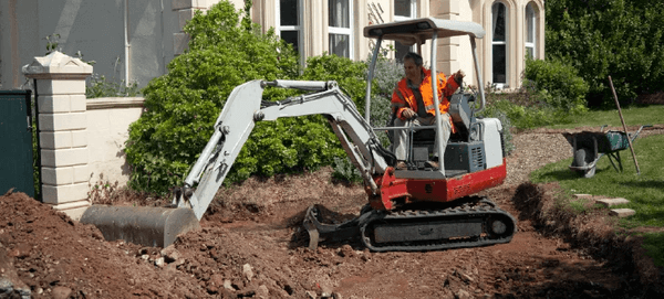 excavating the area where the driveway will be installed