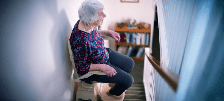 Woman sitting on stairlift